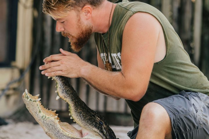 a man holding an animal