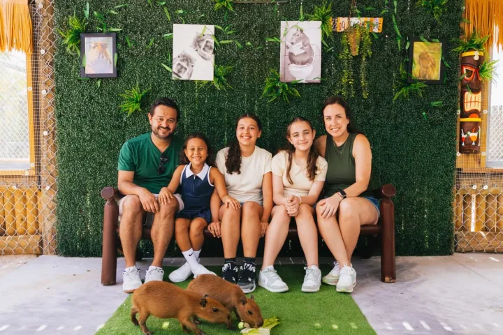 Emily Zak et al. sitting on a bench posing for the camera